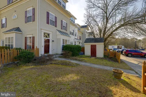 a view of a house with a yard and garage