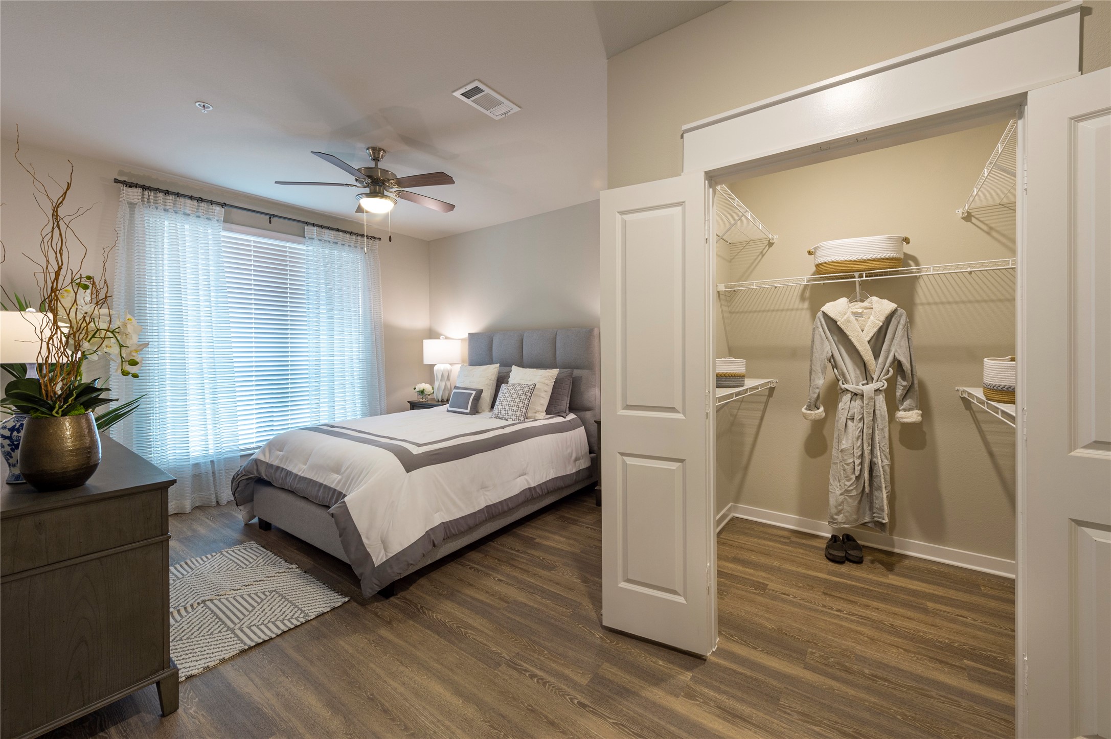 1616 Partnership Way, Unit 1234 Katy, TX 77449 - Photo 18 of 22 a bedroom with a bed and wooden floor