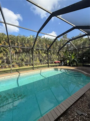 a view of yard with swimming pool