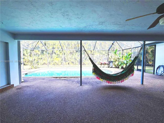 a view of a room with window and pool table