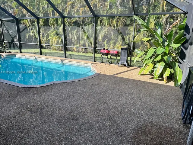 a view of a swimming pool with an outdoor seating