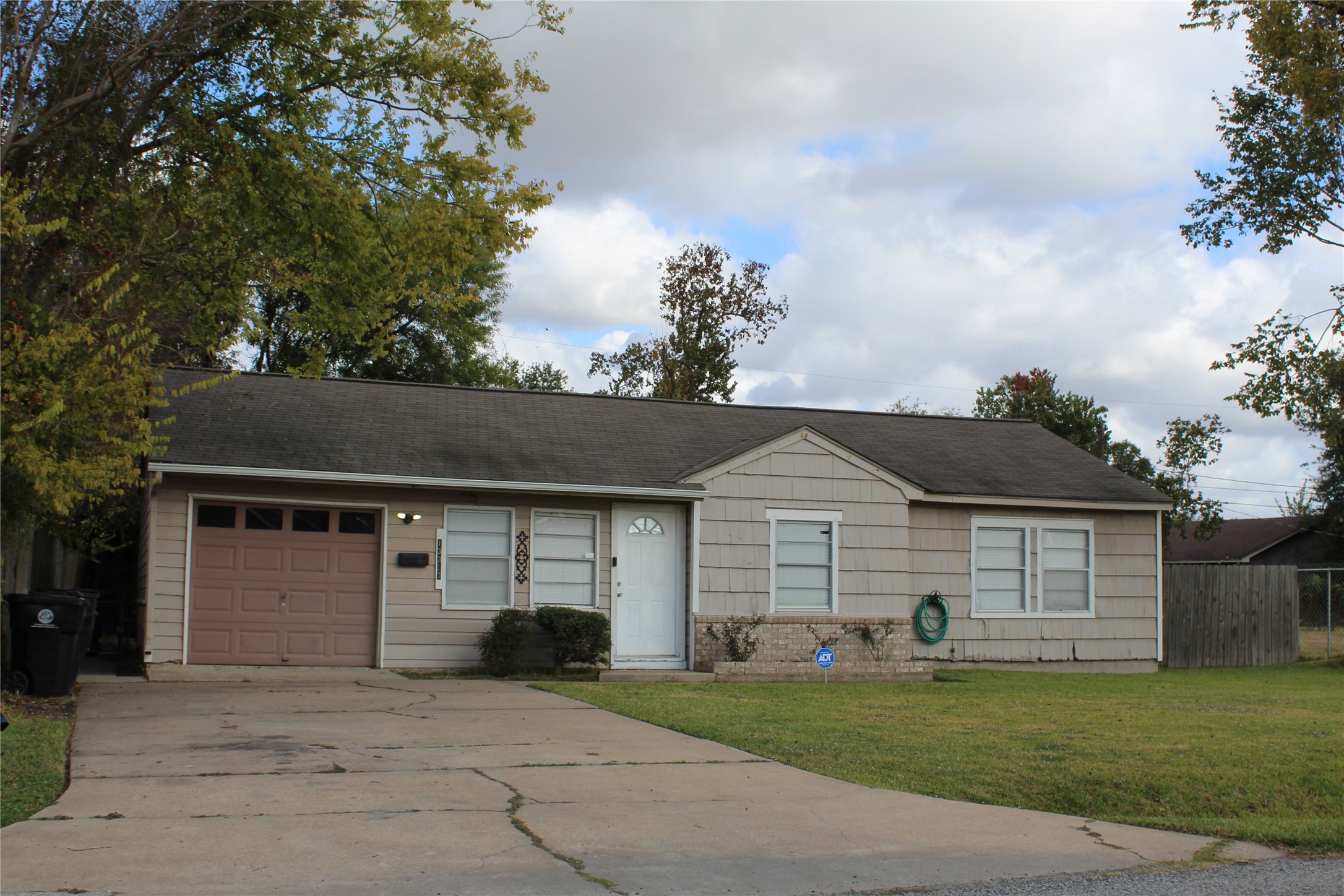 13307 Force Street Houston, TX 77015 - Photo 2 of 18 a front view of a house with a garden and yard