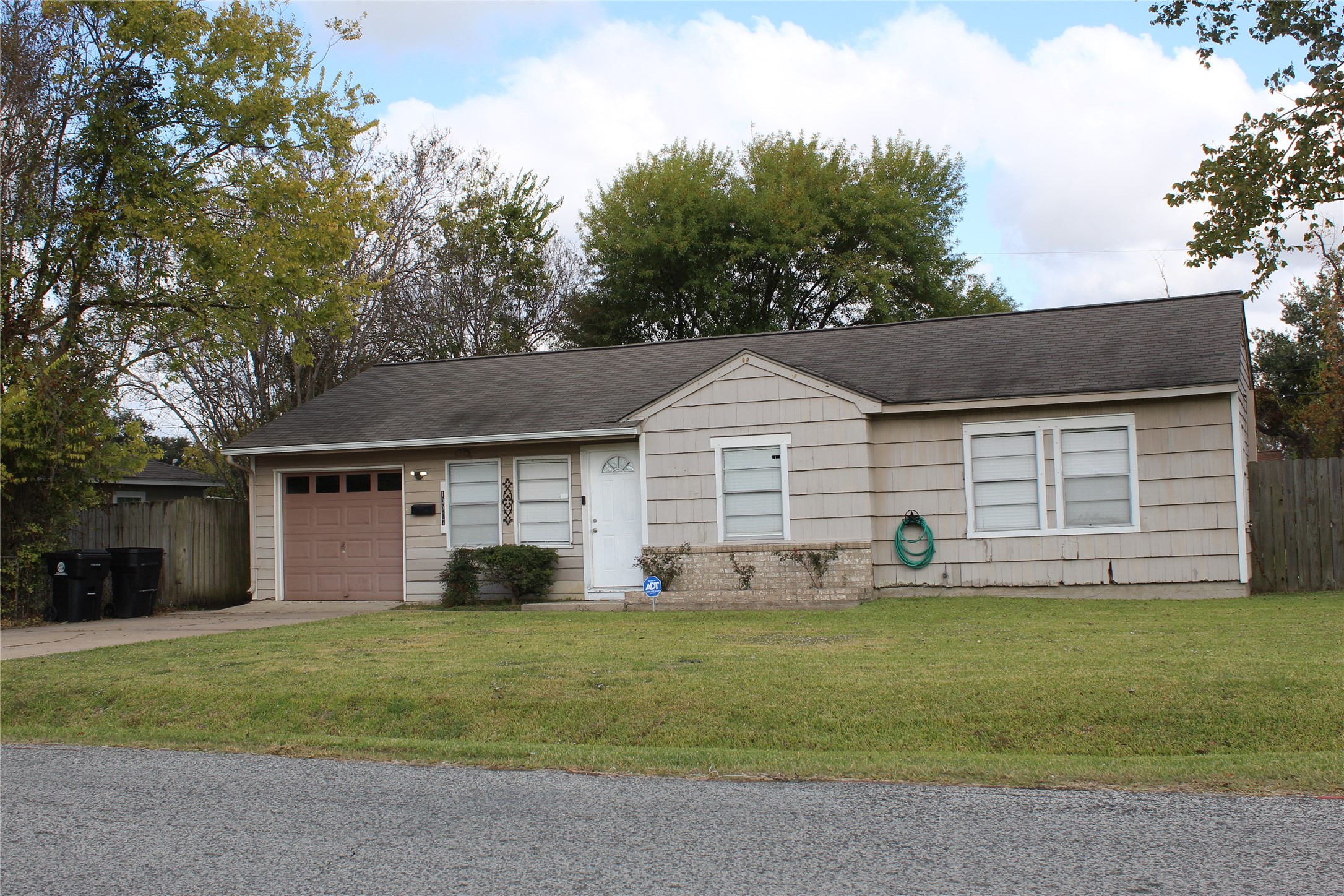13307 Force Street Houston, TX 77015 - Photo 3 of 18 a front view of a house with a yard and trees