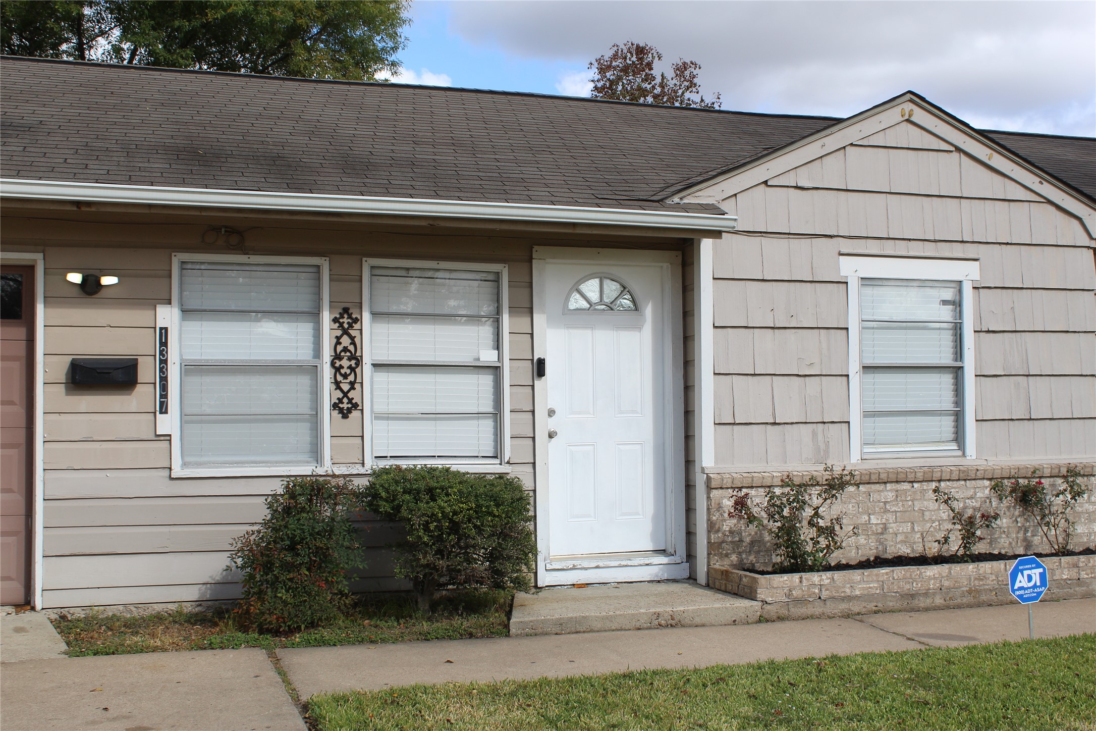 13307 Force Street Houston, TX 77015 - Photo 5 of 18 a front view of a house with a yard