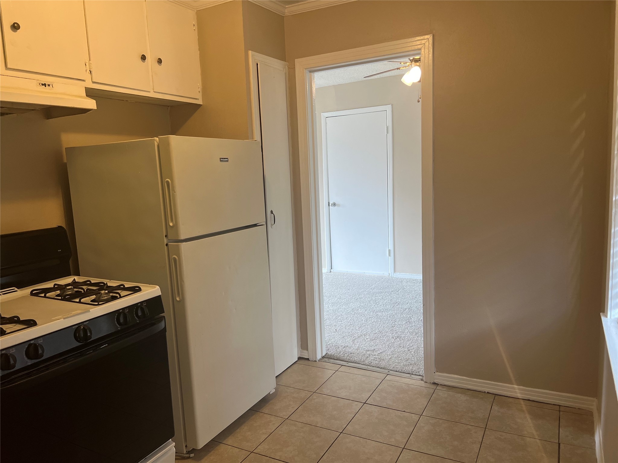 13307 Force Street Houston, TX 77015 - Photo 10 of 18 a view of kitchen cabinets and refrigerator