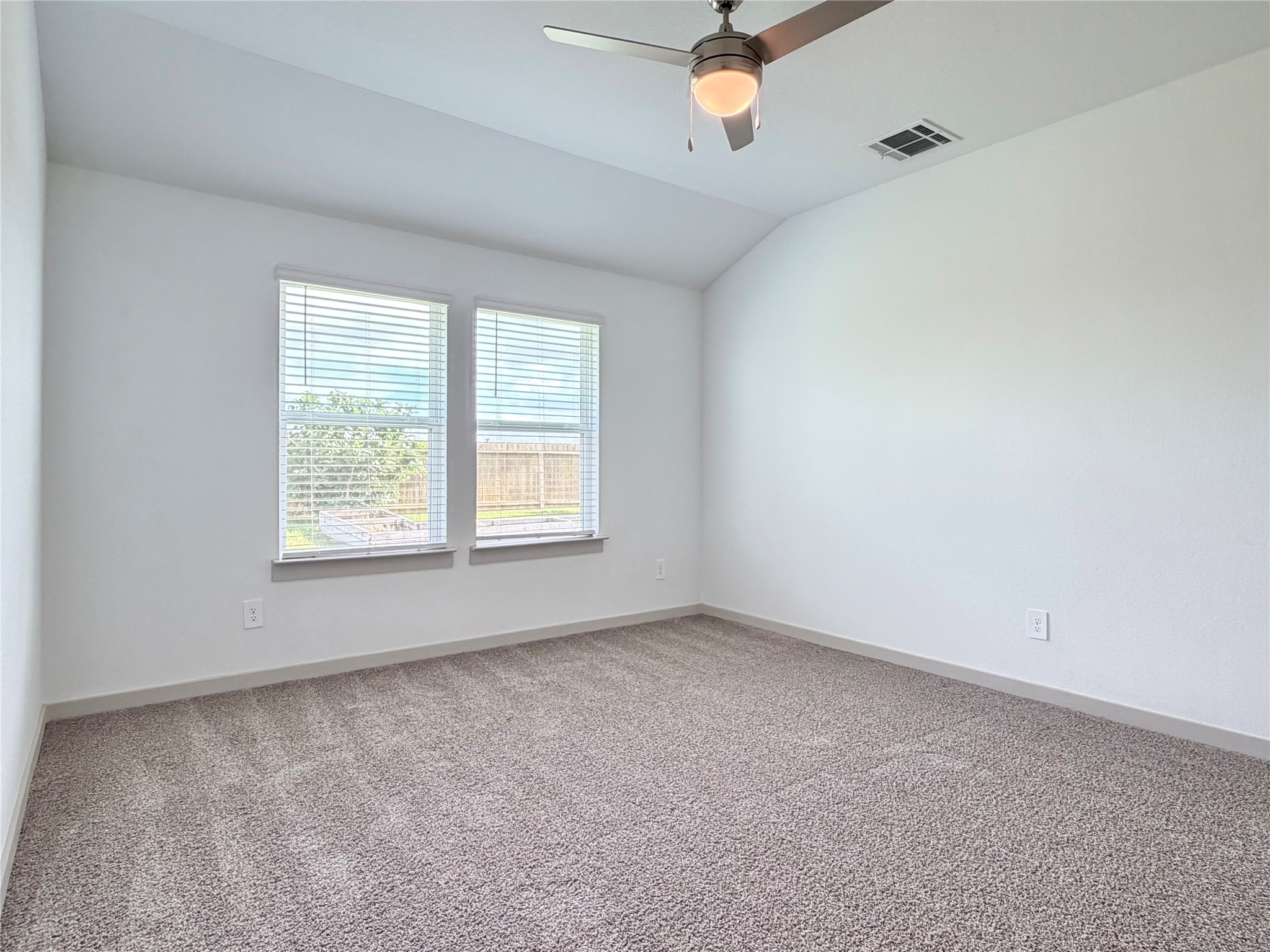 41 Desert Spring Lane Manvel, TX 77578 - Photo 13 of 18 Spacious primary bedroom with en-suite bath, new carpet, ceiling fan.
