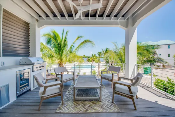a view of a swimming pool with outdoor seating