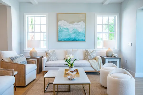 a living room with furniture a table and a window