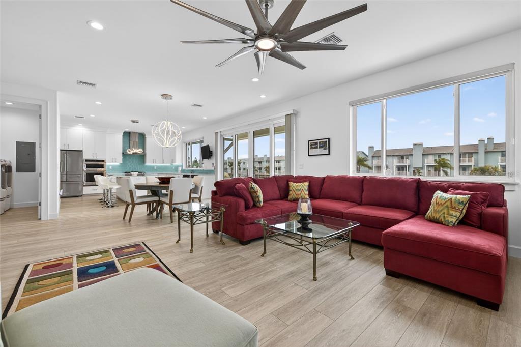 314 6th Avenue Indian Rocks Beach, FL 33785 - Photo 11 of 60 a living room with furniture kitchen view and a dining table