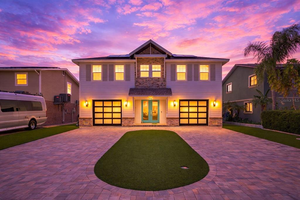314 6th Avenue Indian Rocks Beach, FL 33785 - Photo 2 of 60 a front view of a house with a yard