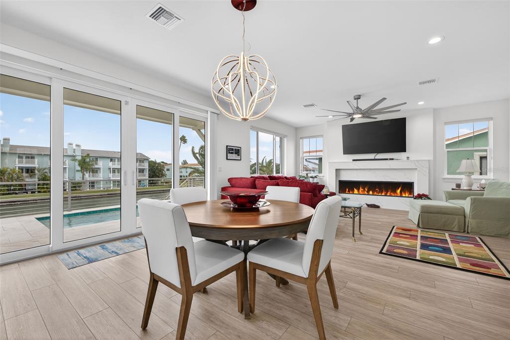 314 6th Avenue Indian Rocks Beach, FL 33785 - Photo 21 of 60 a view of a dining room with furniture window and wooden floor