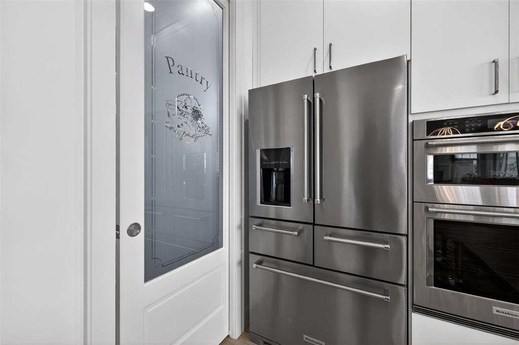 314 6th Avenue Indian Rocks Beach, FL 33785 - Photo 22 of 60 a metallic refrigerator freezer and a stove sitting inside of a kitchen