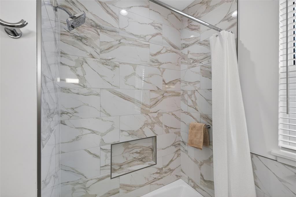 314 6th Avenue Indian Rocks Beach, FL 33785 - Photo 27 of 60 a bathroom with a shower