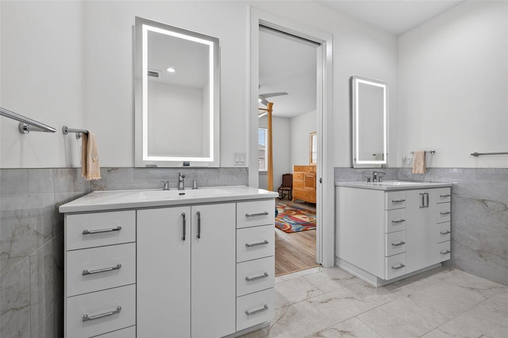 314 6th Avenue Indian Rocks Beach, FL 33785 - Photo 30 of 60 a bathroom with a sink vanity and mirror
