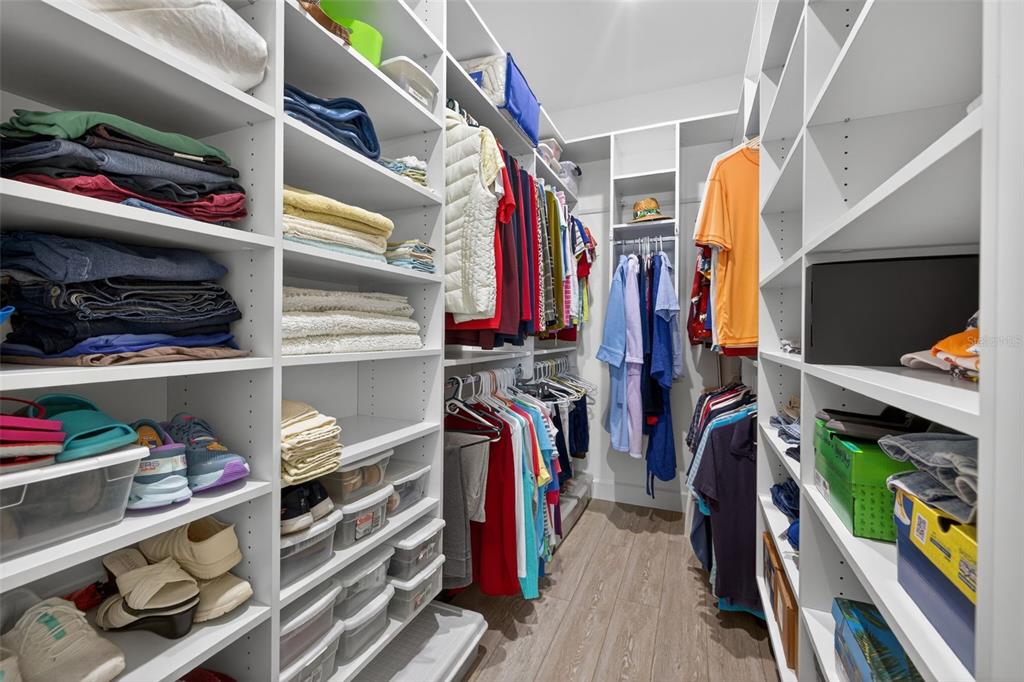314 6th Avenue Indian Rocks Beach, FL 33785 - Photo 32 of 60 a view of walk in closet with clothes and shoes