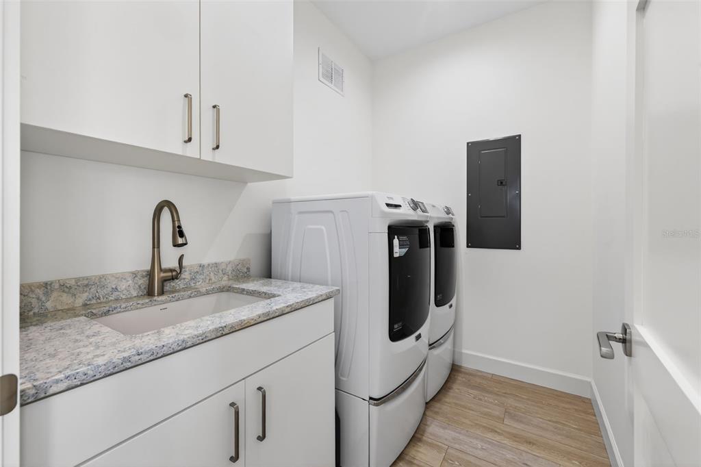 314 6th Avenue Indian Rocks Beach, FL 33785 - Photo 33 of 60 a utility room with sink and dryer
