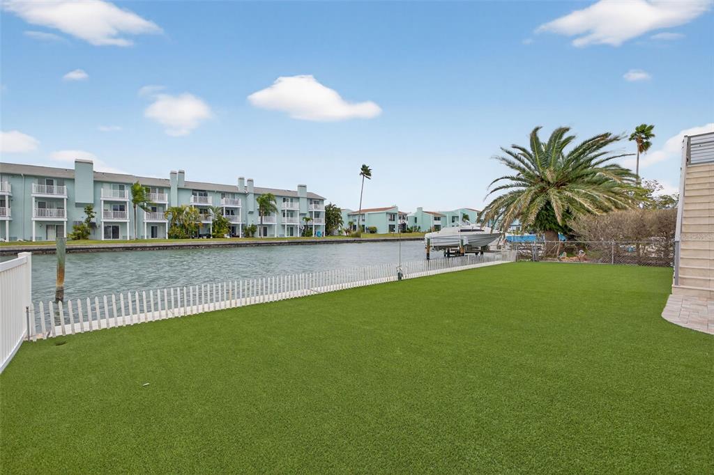 314 6th Avenue Indian Rocks Beach, FL 33785 - Photo 47 of 60 a view of a swimming pool and a yard