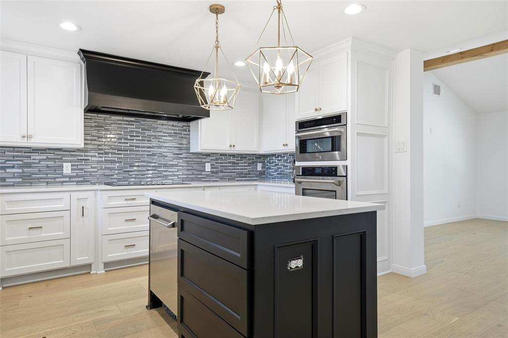 301 West Tinsley Road Robinson, TX 76706 - Photo 11 of 40 a kitchen with stainless steel appliances granite countertop a sink and a microwave