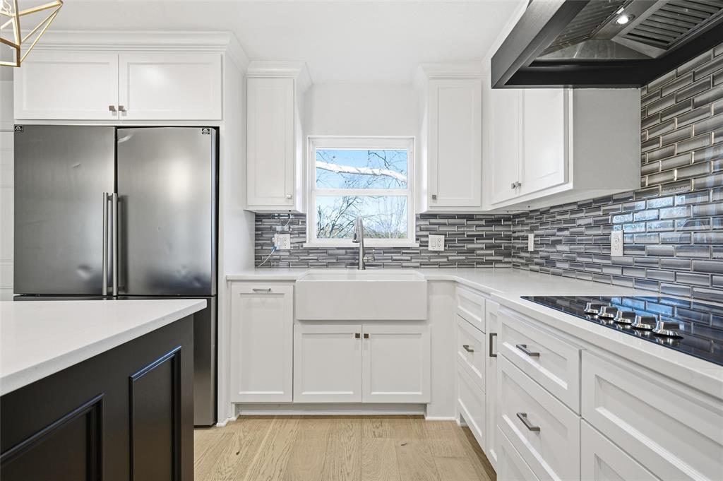 301 West Tinsley Road Robinson, TX 76706 - Photo 13 of 40 a kitchen with white cabinets and refrigerator
