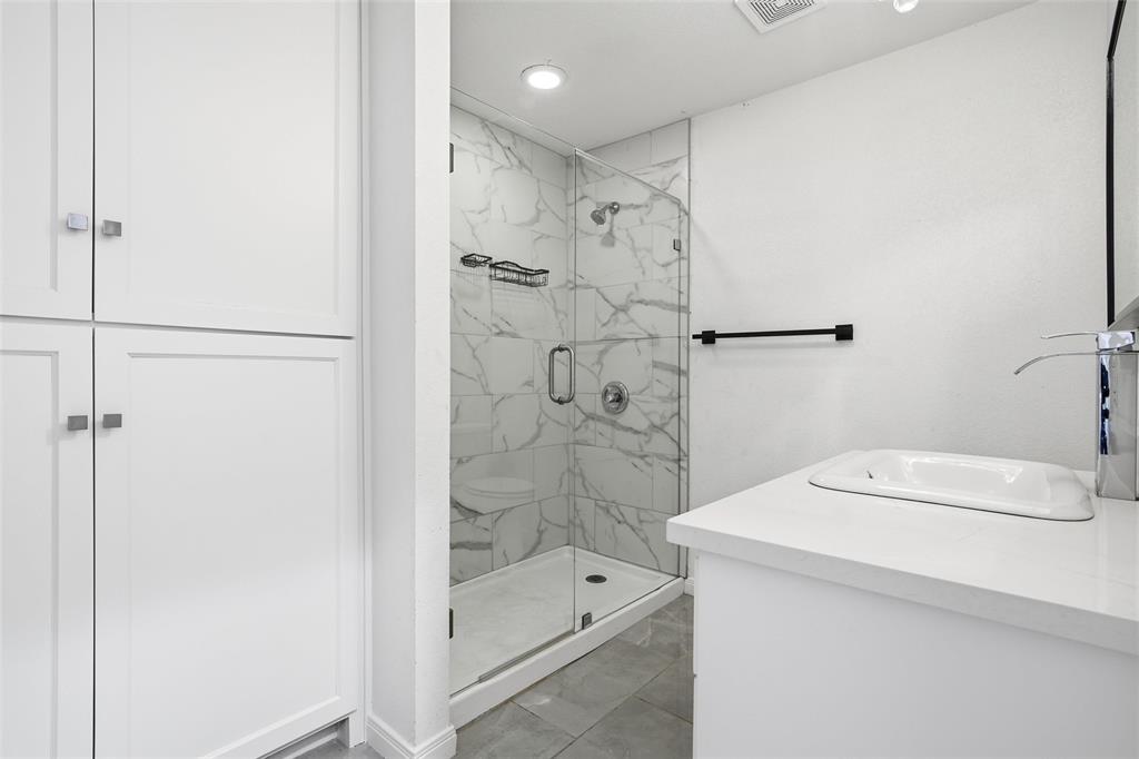 301 West Tinsley Road Robinson, TX 76706 - Photo 16 of 40 a bathroom with a shower and a sink