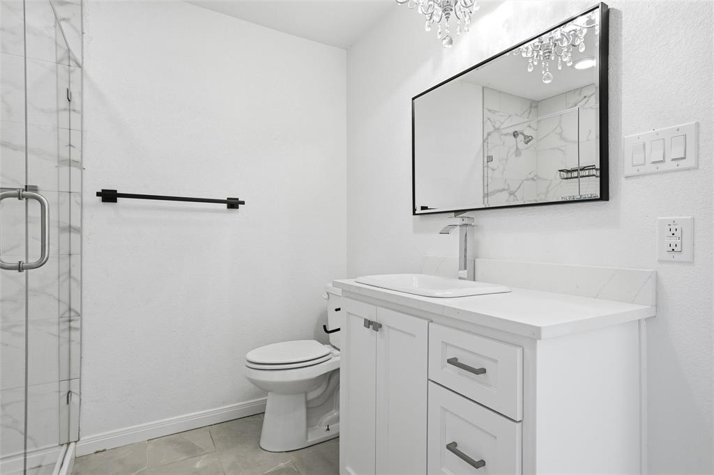 301 West Tinsley Road Robinson, TX 76706 - Photo 17 of 40 a bathroom with a toilet sink and mirror