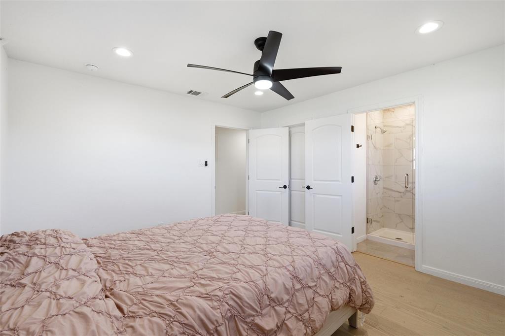 301 West Tinsley Road Robinson, TX 76706 - Photo 25 of 40 a bedroom with a bed and a shower