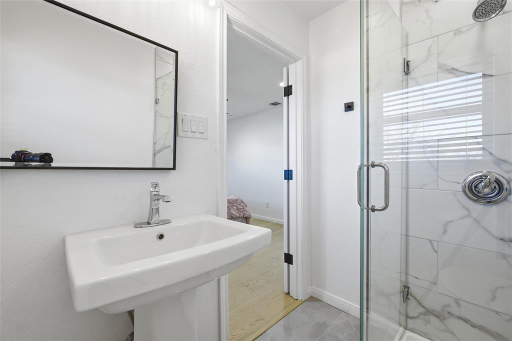 301 West Tinsley Road Robinson, TX 76706 - Photo 28 of 40 a bathroom with a sink and mirror