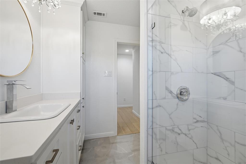 301 West Tinsley Road Robinson, TX 76706 - Photo 30 of 40 a bathroom with a sink and mirror