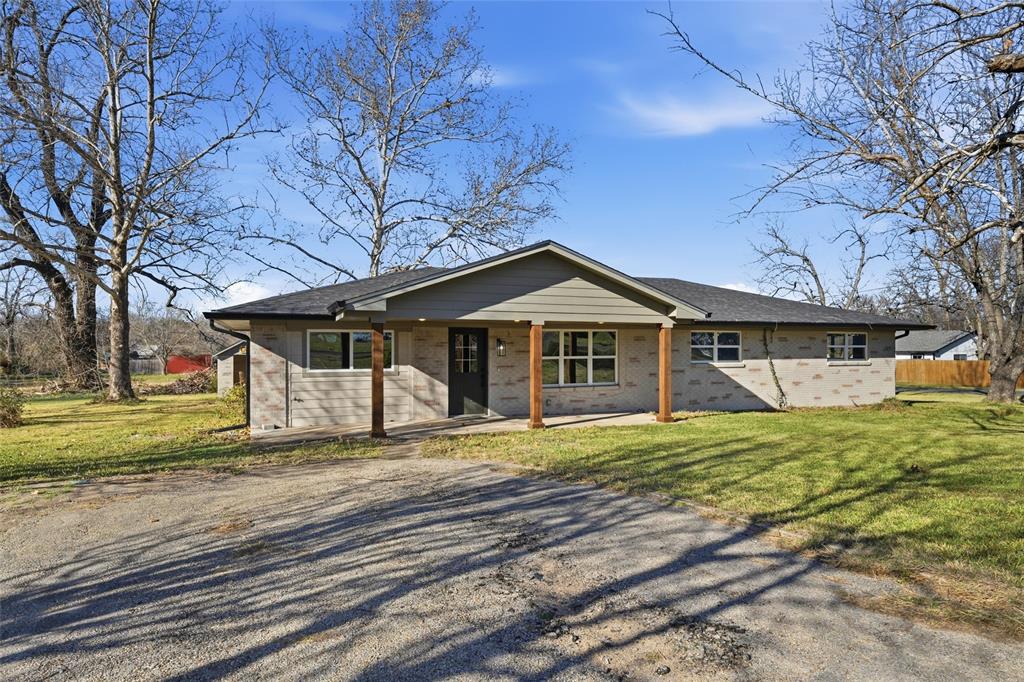 301 West Tinsley Road Robinson, TX 76706 - Photo 3 of 40 a front view of a house with a yard