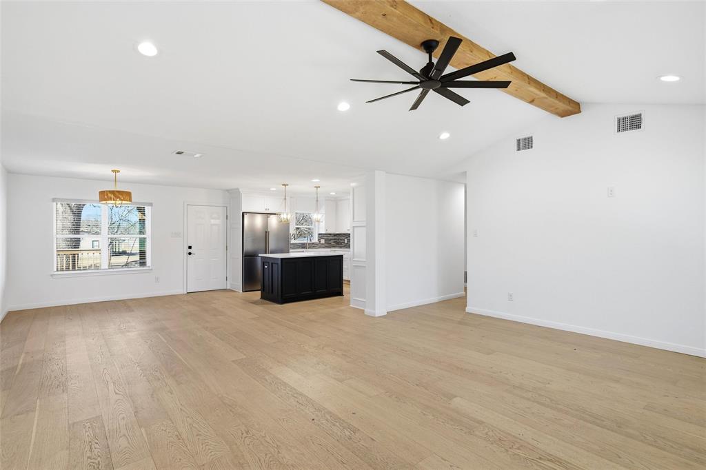 301 West Tinsley Road Robinson, TX 76706 - Photo 4 of 40 a view of workspace with wooden floor and a ceiling fan