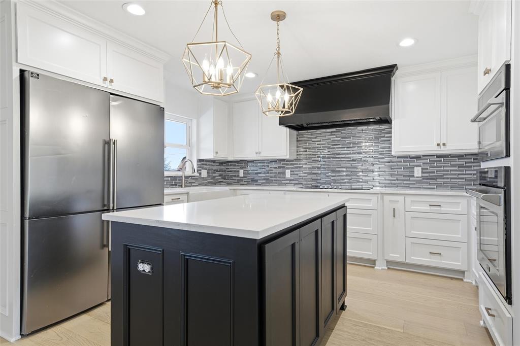 301 West Tinsley Road Robinson, TX 76706 - Photo 10 of 40 a kitchen with stainless steel appliances granite countertop a sink and refrigerator