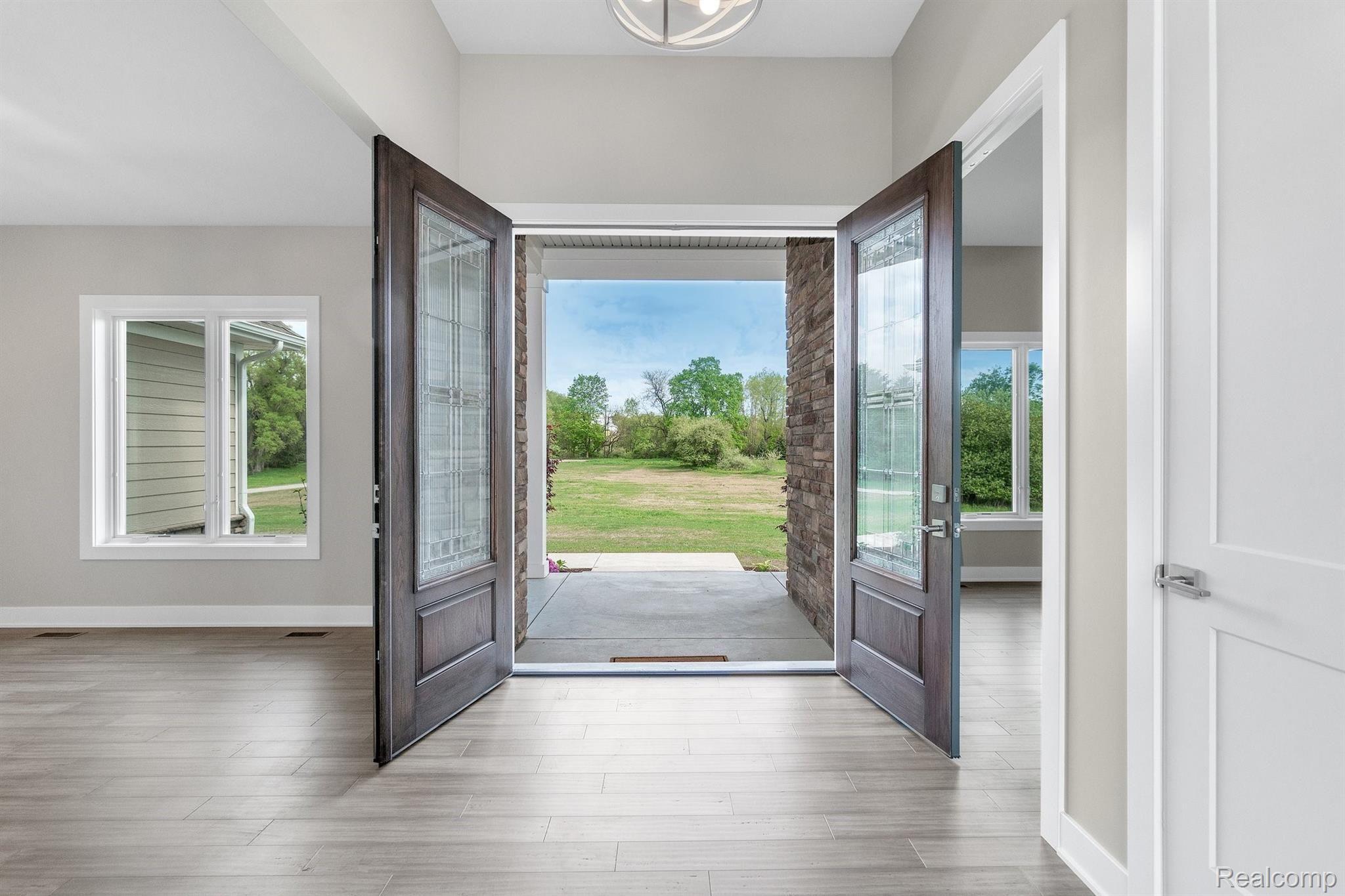 12240 Hibner Road Hartland, MI 48353 - Photo 5 of 37 Front door, open to large front yard