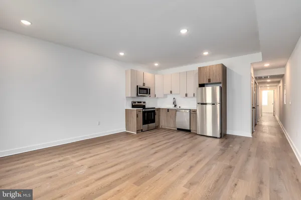 a view of kitchen with wooden floor