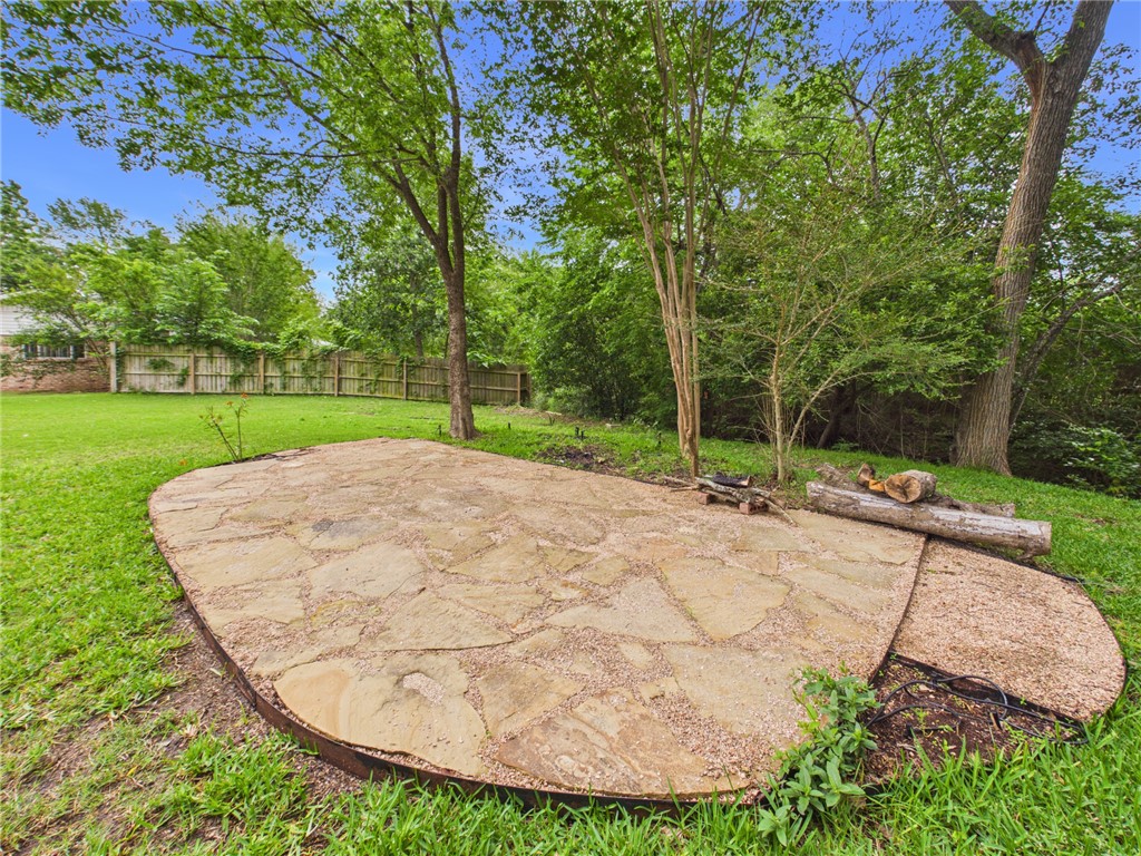 902 Briar Bend Court Bryan, TX 77802 - Photo 38 of 39 a view of a backyard with a fountain