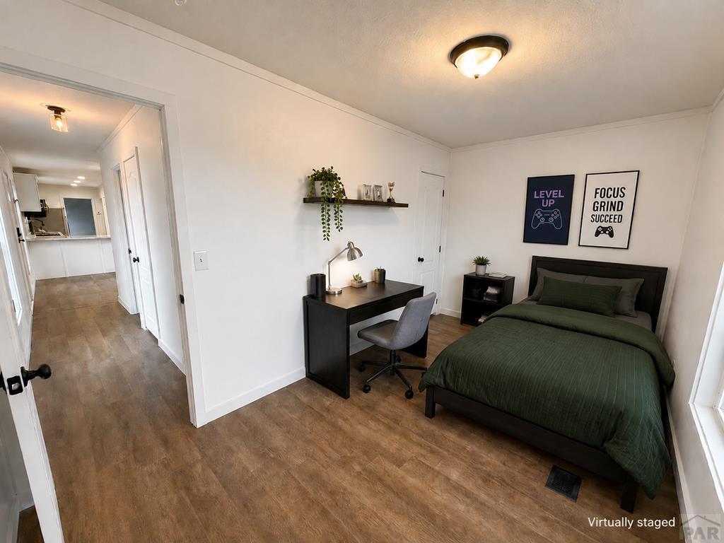 6652 County Rd HH.5 Lamar, CO 81052 - Photo 20 of 22 a living room with furniture and a wooden floor