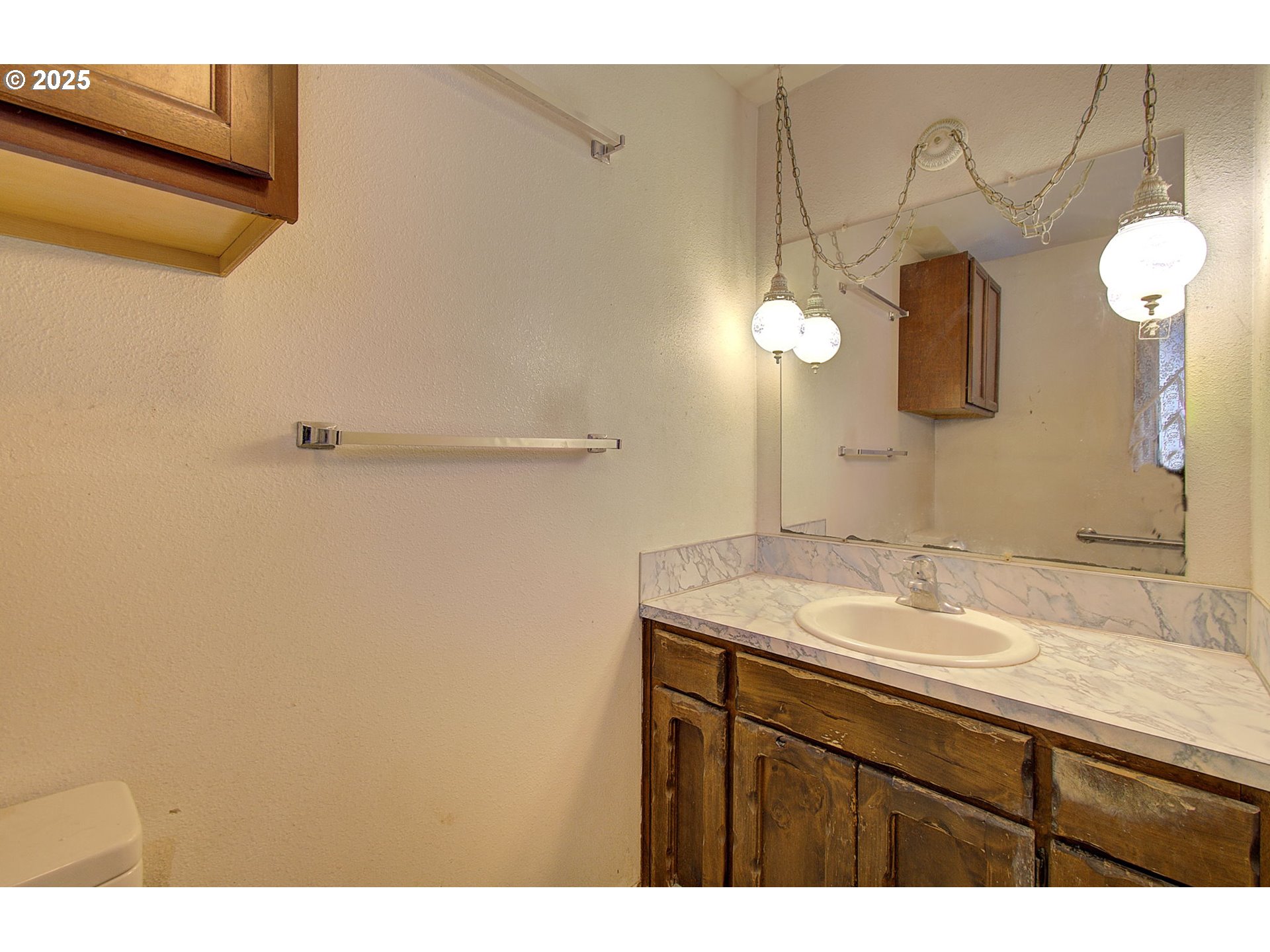 19409 Northeast Mattson Road Brush Prairie, WA 98606 - Photo 22 of 44 a bathroom with a sink and a mirror