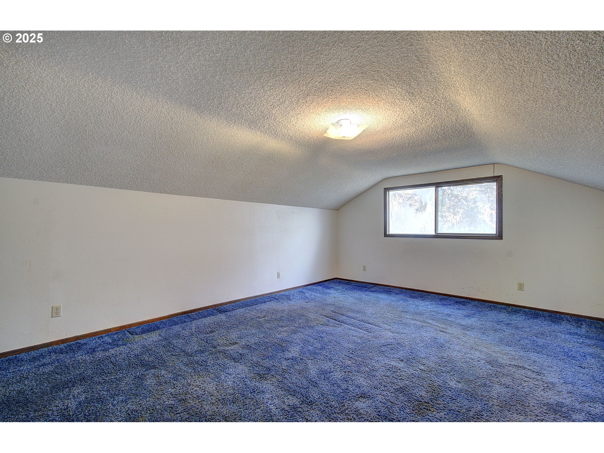 19409 Northeast Mattson Road Brush Prairie, WA 98606 - Photo 24 of 44 a view of an empty room with wooden floor and a window