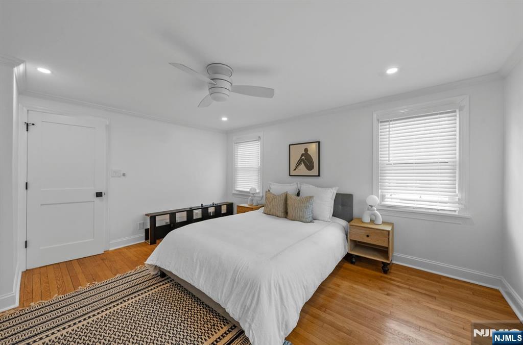 301 New Bridge Road Bergenfield, NJ 07621 - Photo 14 of 27 a bedroom with a bed and wooden floor