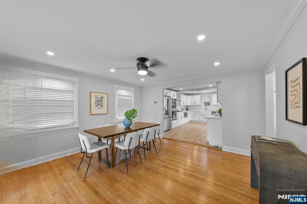 301 New Bridge Road Bergenfield, NJ 07621 - Photo 2 of 27 a view of a dining room with furniture and wooden floor