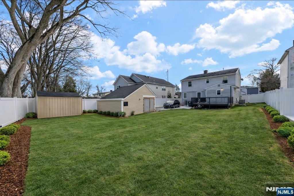 301 New Bridge Road Bergenfield, NJ 07621 - Photo 26 of 27 a view of a house with backyard