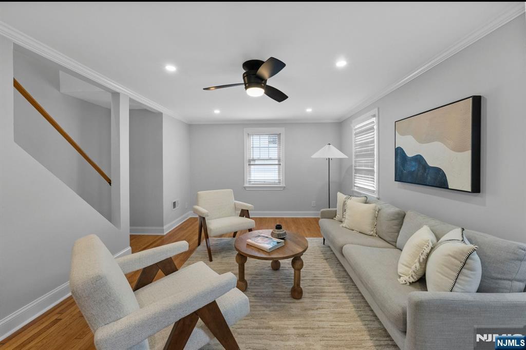 301 New Bridge Road Bergenfield, NJ 07621 - Photo 3 of 27 a living room with furniture and wooden floor