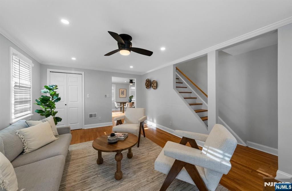 301 New Bridge Road Bergenfield, NJ 07621 - Photo 8 of 27 a living room with furniture and a potted plant