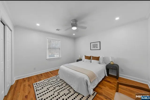 a bedroom with a bed and a chair