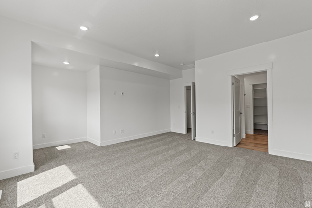 3410 South 1010th Street West Logan, UT 84321 - Photo 7 of 15 Unfurnished room featuring light carpet and recessed lighting