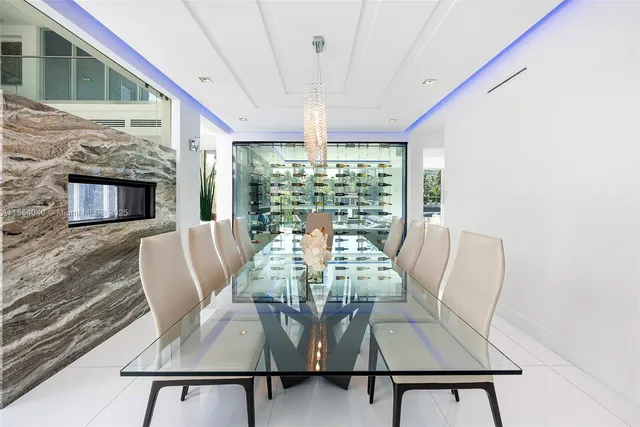 a living room with furniture and large windows