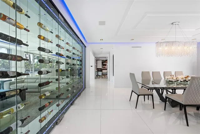 a living room with furniture a large window and flat screen tv