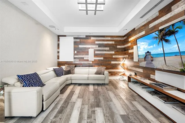 a kitchen with stainless steel appliances a stove a sink and a refrigerator