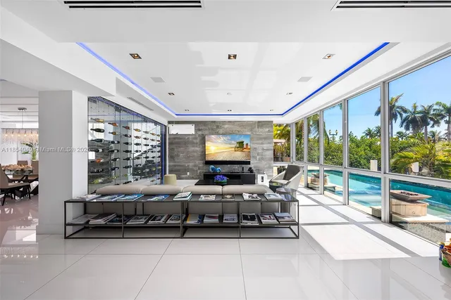 a kitchen with stainless steel appliances granite countertop a sink and a refrigerator