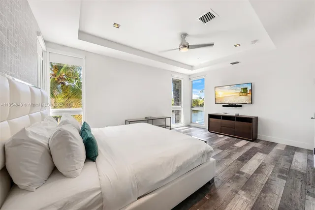 a spacious bathroom with a granite countertop sink mirror and a