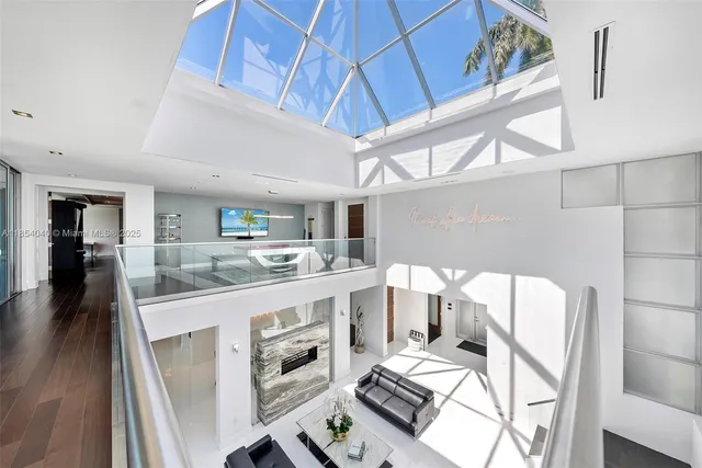 an aerial view of a house with a swimming pool